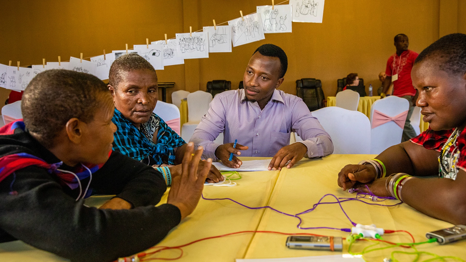 group of people at a table doing an activity